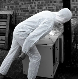 man wearing a PPE coverall suit