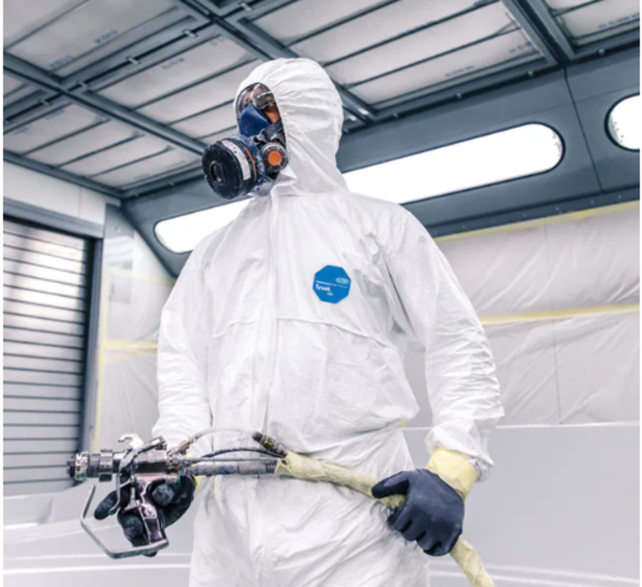 Man wearing a PPE coverall suit and mask.