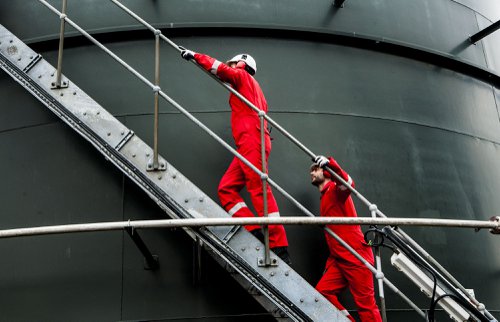 Men wearing FR workwear suits.